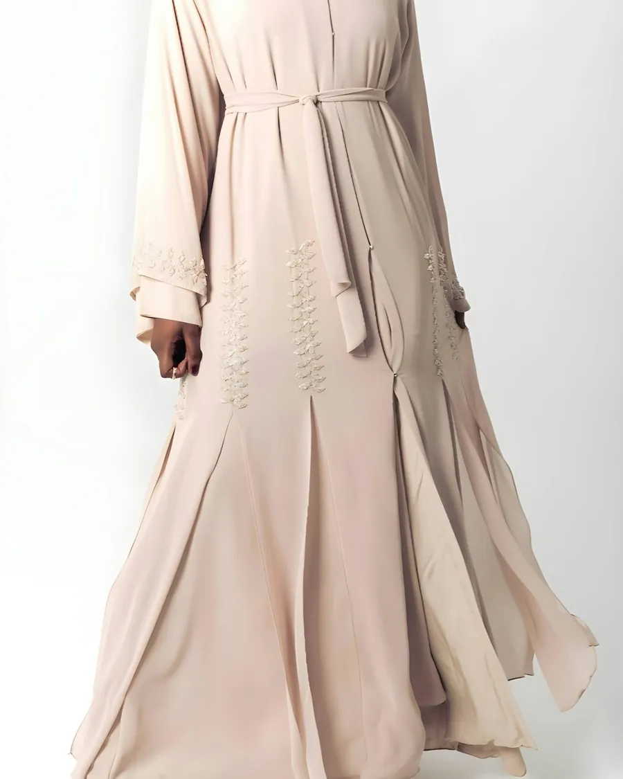 Woman in a beige embroidered abaya